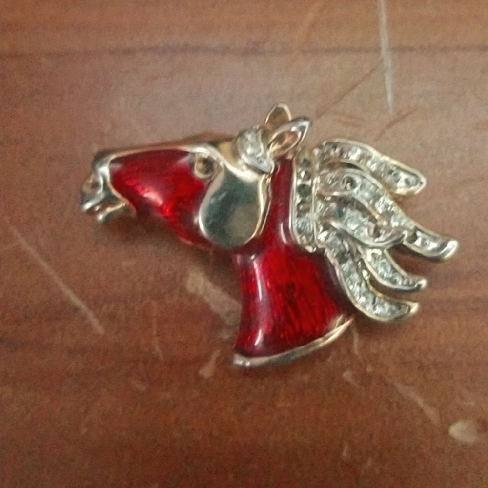 Family heirloom ruby diamond encrusted stallion pin